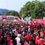 Rangkul Masyarakat Pesisir, Telkomsel Gelar Acara Jalan Sehat di Kota Cirebon